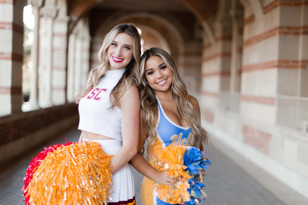 USC Song Girls captain Hannah Shaw, left, and her cousin, UCLA dance team member Lauren Shaw, pose for a portrait.