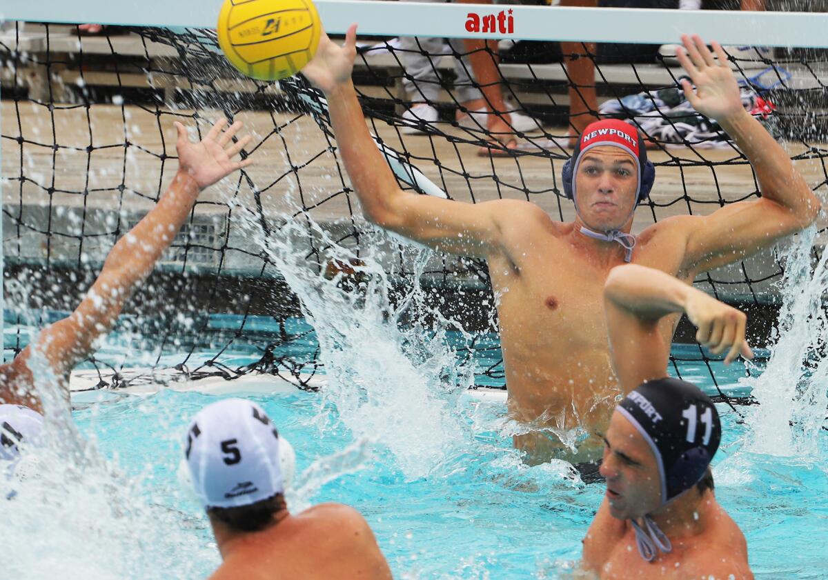 Newport Harbor goalie Connor Clougherty (1A) blocks Harvard-Westlake's Collin Caras (5) during the South Coast Tournament.