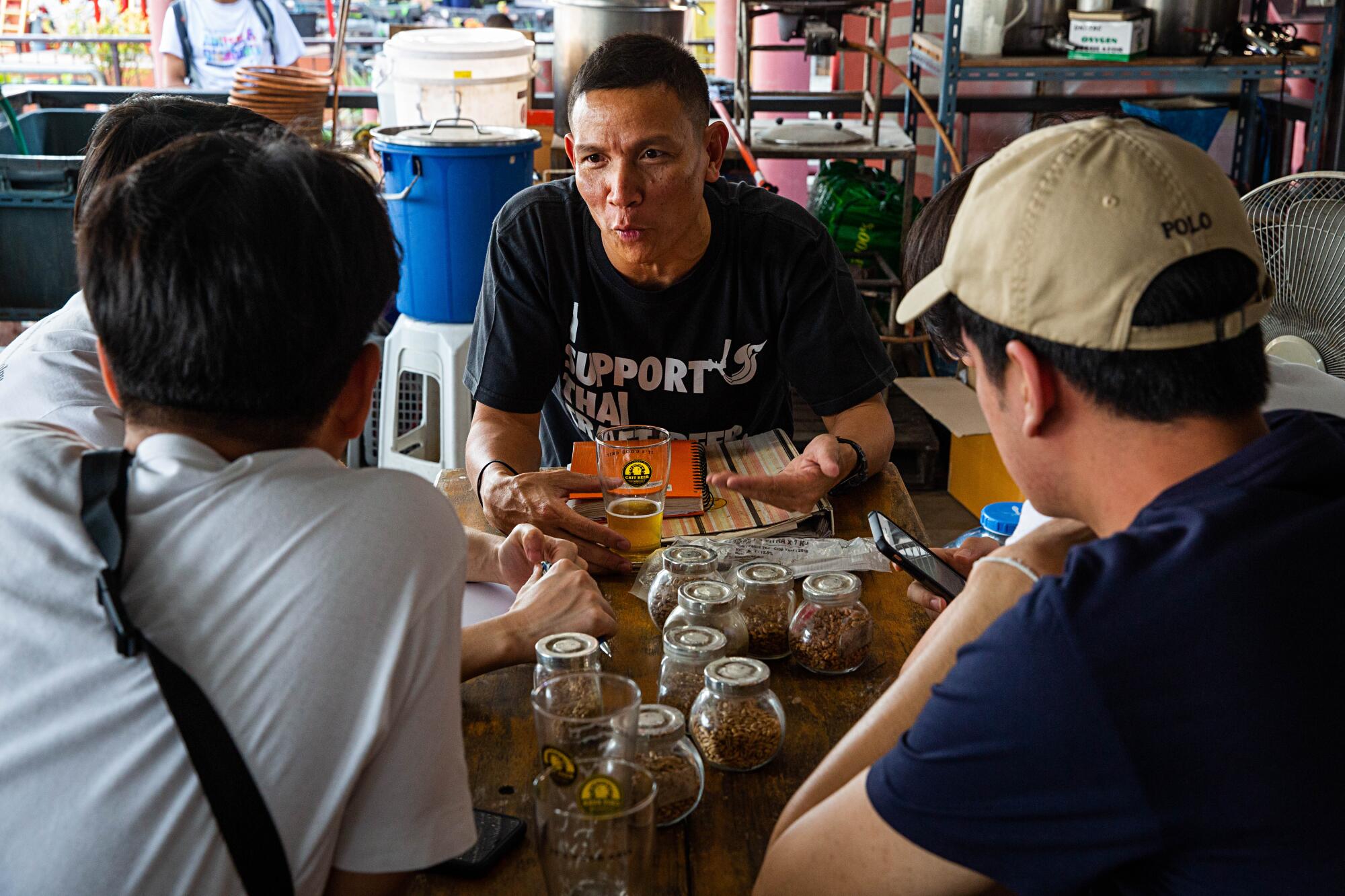 Wichit "Chit" Saiklao conducts a beer-brewing class in February 2020 in Thailand.