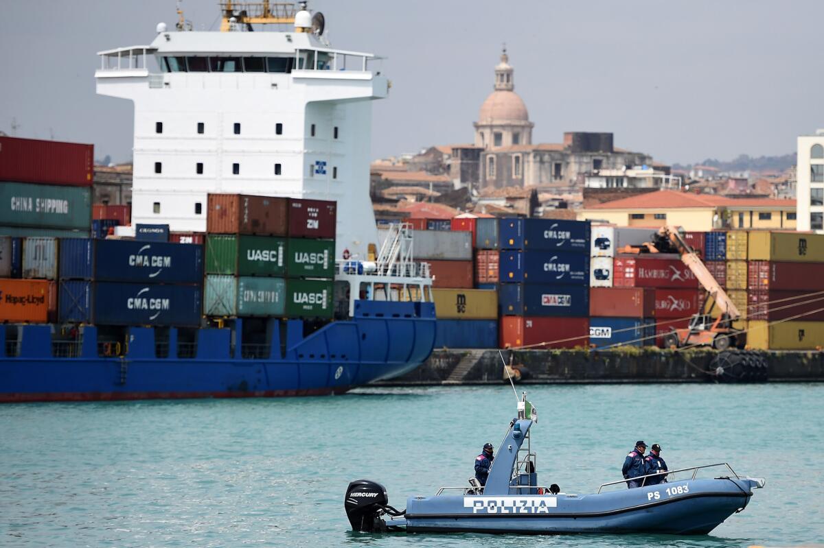 A police boat is seen at the Catania port awaiting an Italian coast guard ship that will arrive in the evening carrying migrants who survived after their ship capsized off Libya over the weekend. Hundreds of migrants are believed to have perished as they attempted to cross the Mediterranean from Libya to Italy.