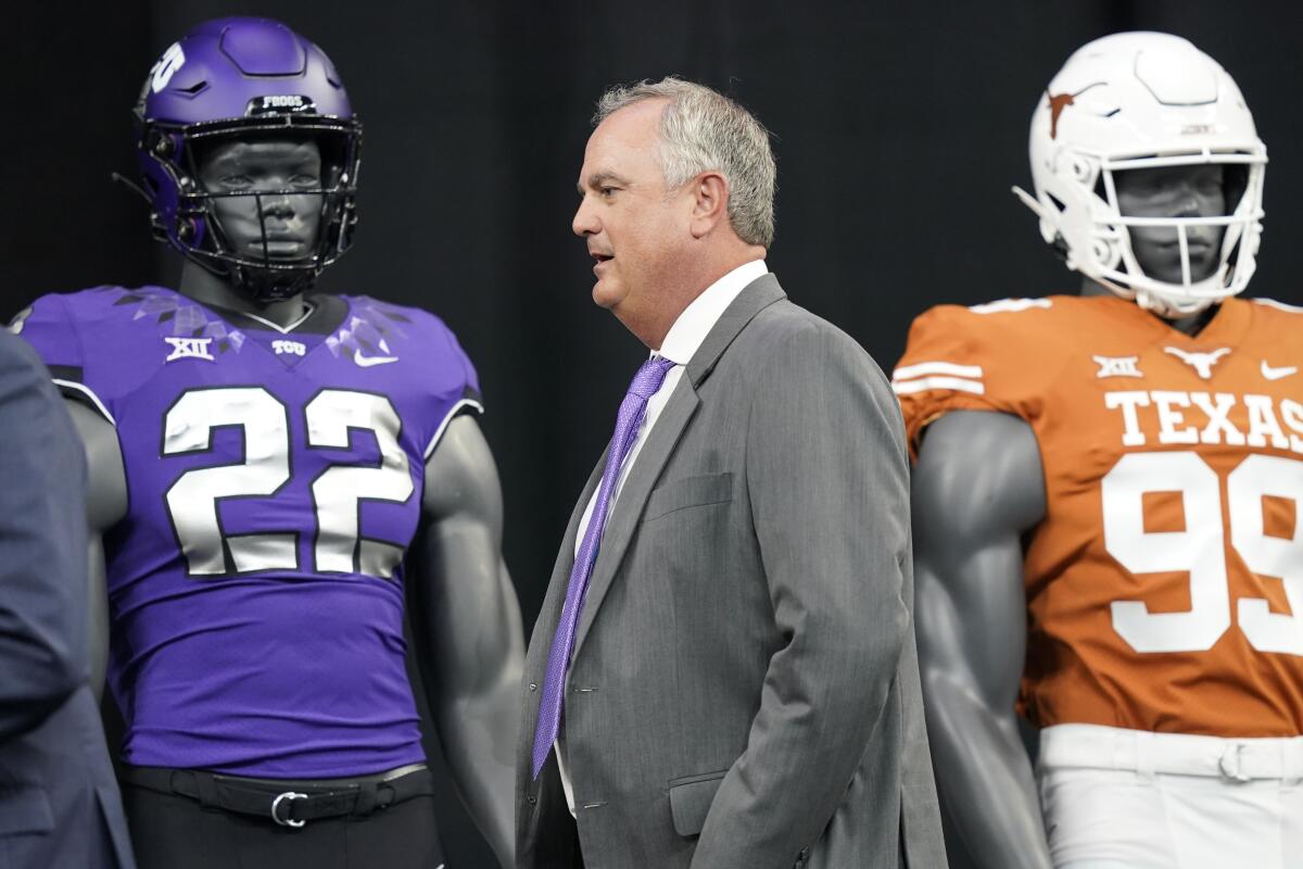 TCU coach Sonny Dykes takes the stage to speak to reporters at the NCAA college football Big 12 media days in Arlington, Texas, Thursday, July 14, 2022. (AP Photo/LM Otero)
