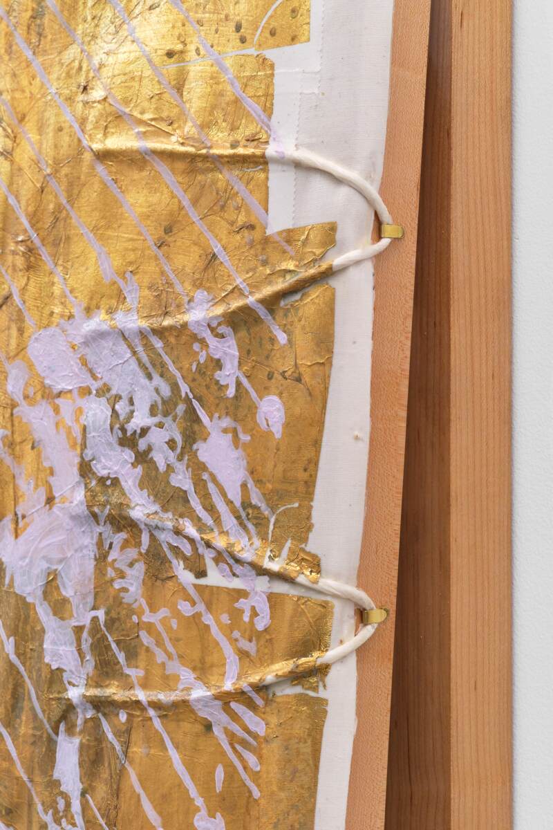 A detail of a painting with string in the paint