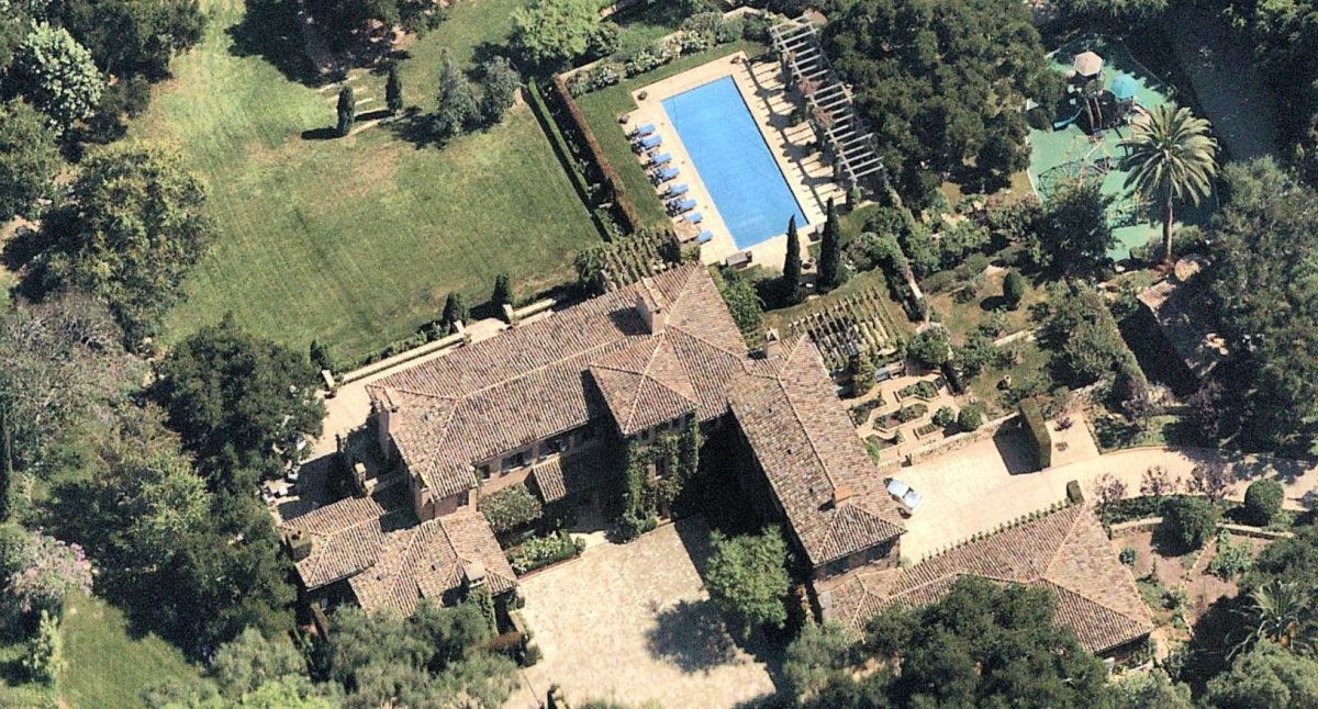 An aerial view of the 7-acre estate in Montecito with a guesthouse, a pool, a tennis court, gardens and a playground