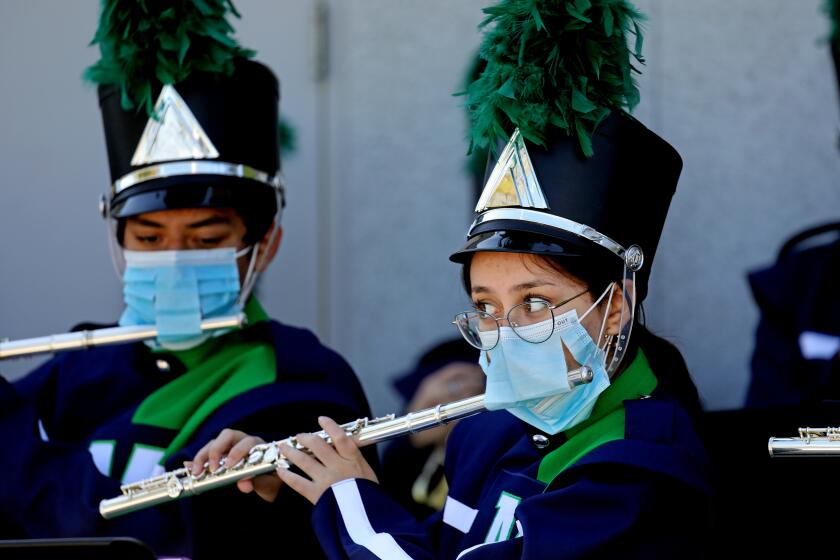 MAYWOOD, CA - FEBRUARY 16: Band members play the school's fight song while Superintendent Alberto M. Carvalho, Los Angeles Unifed School District, enters the campus to tour Maywood Center For Enriched Studies (MaCES) Magnet school on Wednesday, Feb. 16, 2022 in Maywood, CA. Superintendent Carvalho conducted a two-day school tour, visiting special programs and classrooms at sites across the District. (Gary Coronado / Los Angeles Times)