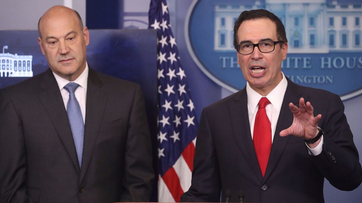 Gary Cohn, director of the White House National Economic Council, left, and Treasury Secretary Steven T. Mnuchin speak to reporters about President Trump's tax plan on Wednesday at the White House. (Mark Wilson / Getty Images)