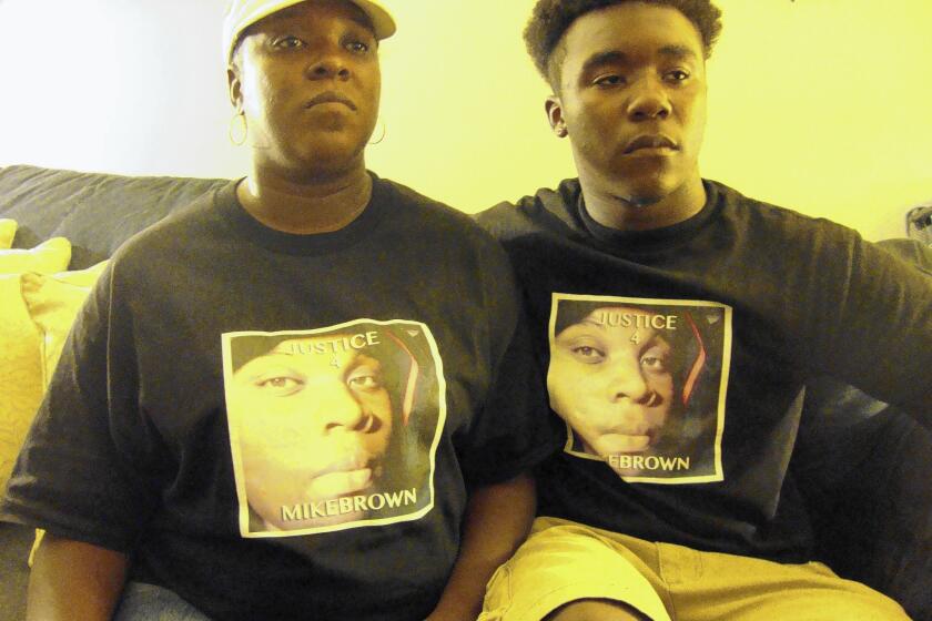 Michael Brown's cousin Christine Ewings, left, and her son Daryus Watson, 16.