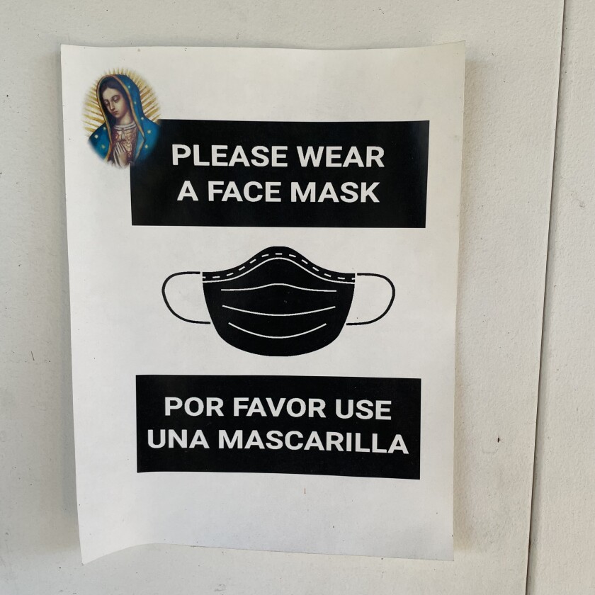 A sign urging people to wear masks in the shrine of Maria Guadalupe.