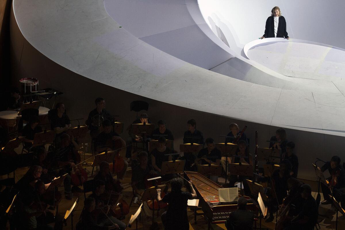 The L.A.Philharmonic rehearses with Swedish soprano Miah Persson, top, at Disney Hall for “Cosí fan tutte” on a stage created by Zaha Hadid’s firm.