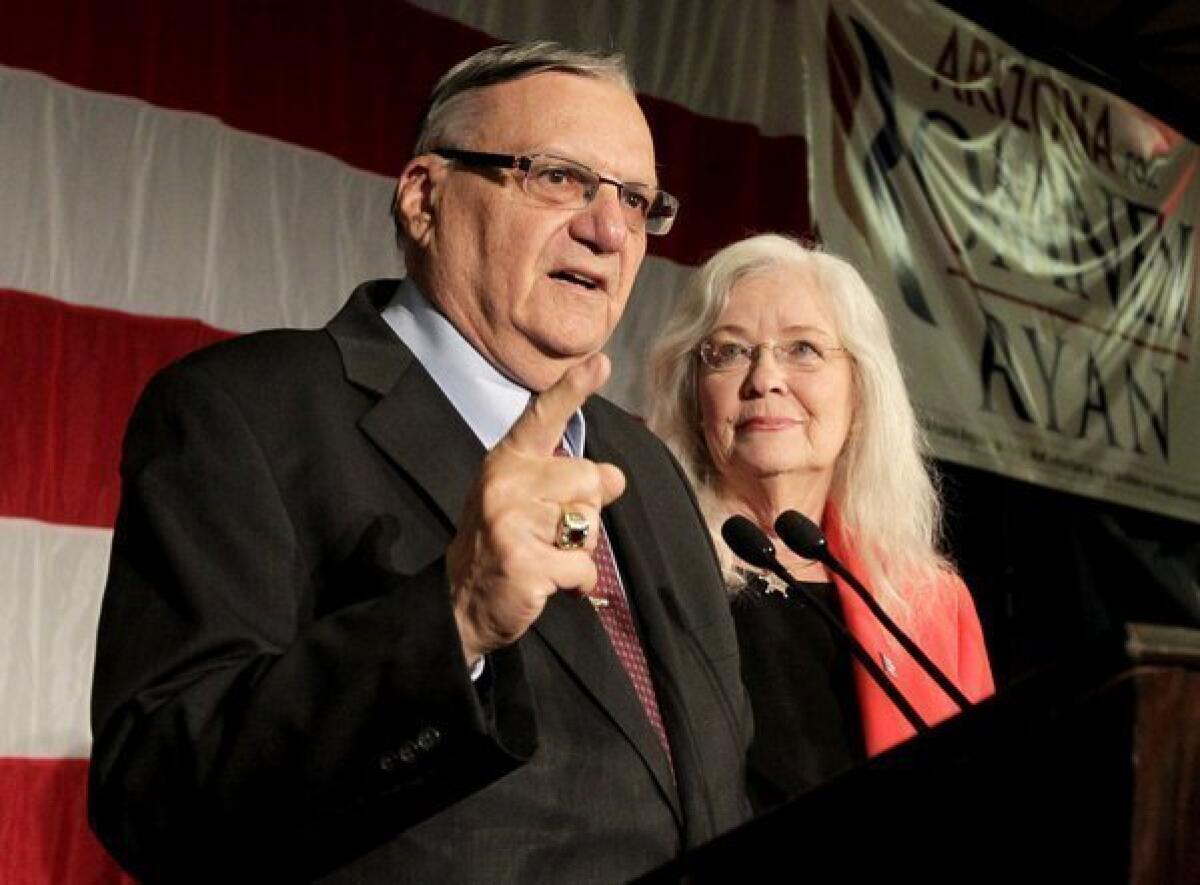 Maricopa County Sheriff Joe Arpaio with his wife, Eva, speaks to supporters during an election night party in Phoenix.