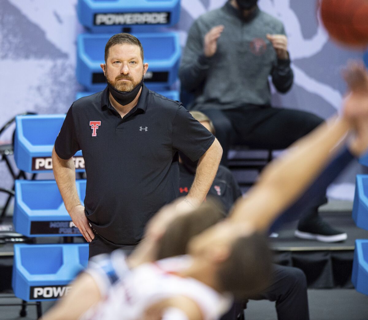 Texas Tech head coach Chris Beard watches the action on the court from the sideline during the first half of a first round game against Utah State in the NCAA men's college basketball tournament, Friday, March 19, 2021, in Bloomington, Ind. (AP Photo/Doug McSchooler)