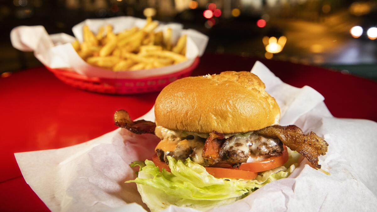 The Luna Burger, $13.99, shown with optional gluten free bun, $2, and a side of fries, $3.99, is on the menu at Cool Cat Cafe in Lahaina, Hawaii.