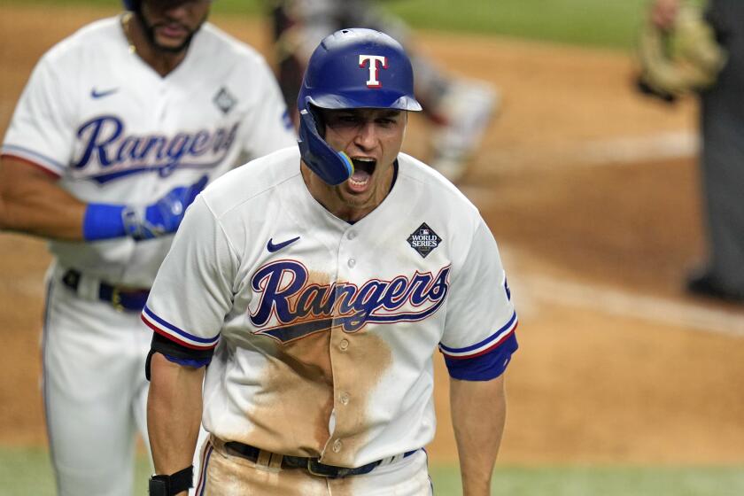 Texas Rangers' Corey Seager celebrates after hitting a two-run home run.