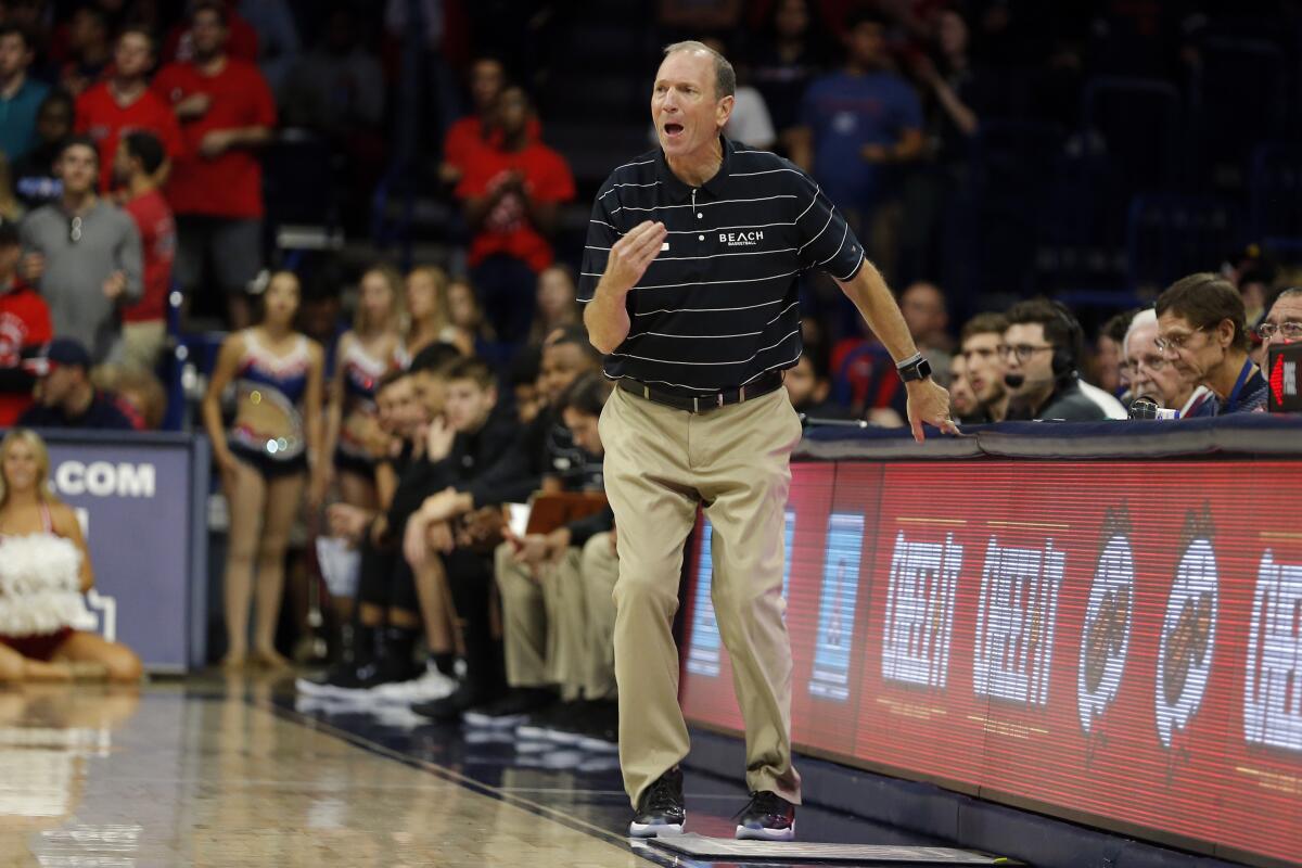 Long Beach State coach Dan Monson coaches from the bench.