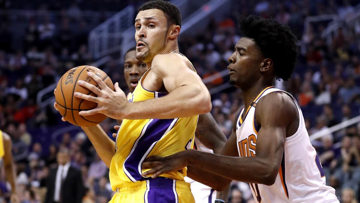 Lakers forward Larry Nance Jr. works in the post against Phoenix Suns forward Marquese Chriss during a game earlier this season.