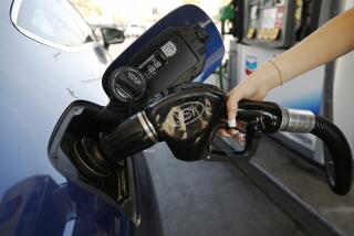 LOS ANGELES, CA - NOVEMBER 15: Montana Tomkyns, 23, puts fuel in her gas tank as drivers select from various fuels all priced over $6 dollars at a Chevron Gas Station located at North Alameda and West Cesar Chavez Ave near Union Station in downtown Los Angeles as California gas prices hit an average price of $4.676 Sunday, setting the highest recorded average price for regular gasoline, according to AAA. America's largest state by population has the highest gas prices in the country. The national average dropped slightly to $3.413 Sunday. Downtown on Monday, Nov. 15, 2021 in Los Angeles, CA. (Al Seib / Los Angeles Times).