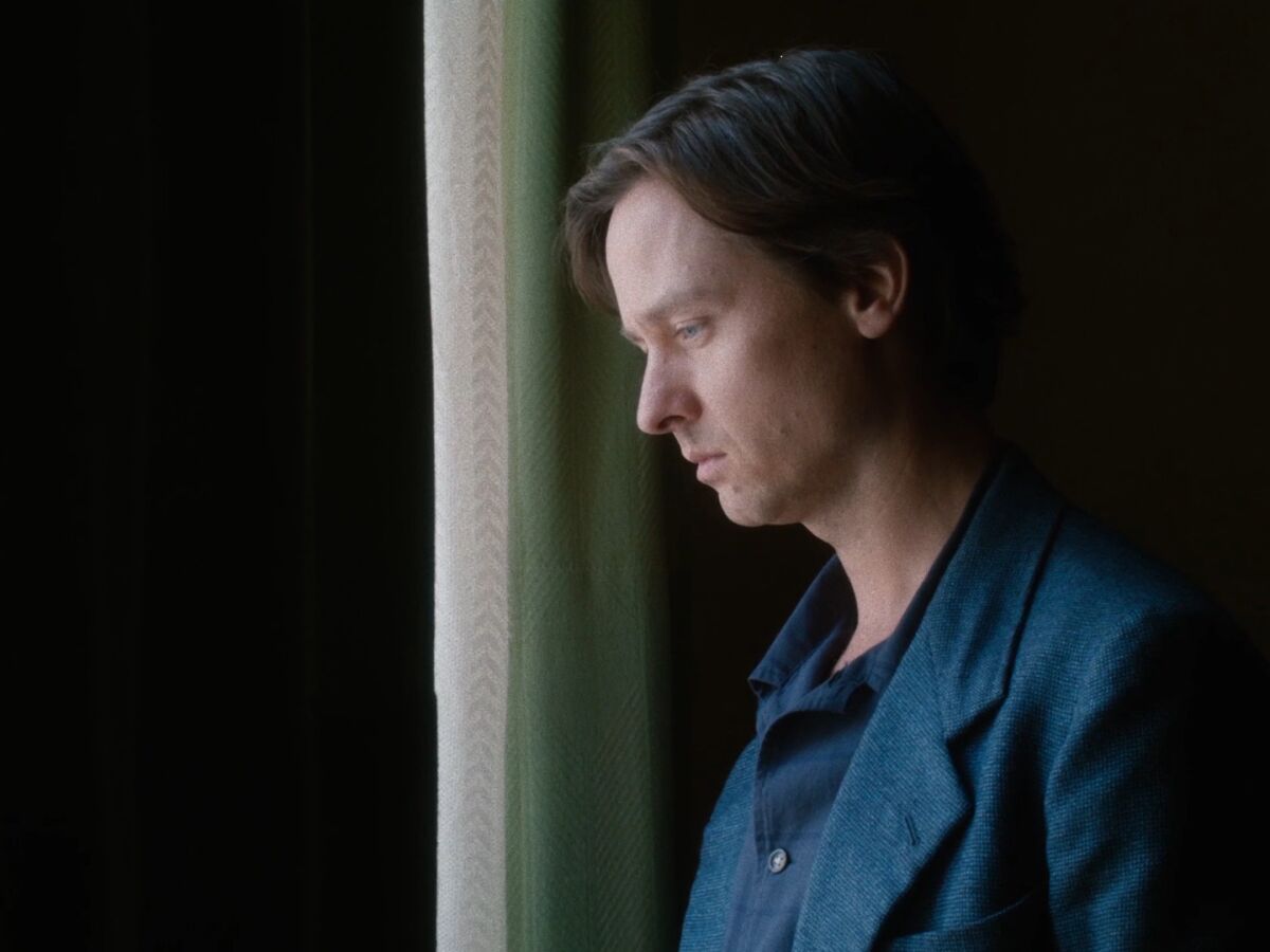 A young man in a blue suit in the movie “Fabian: Going to the Dogs.”
