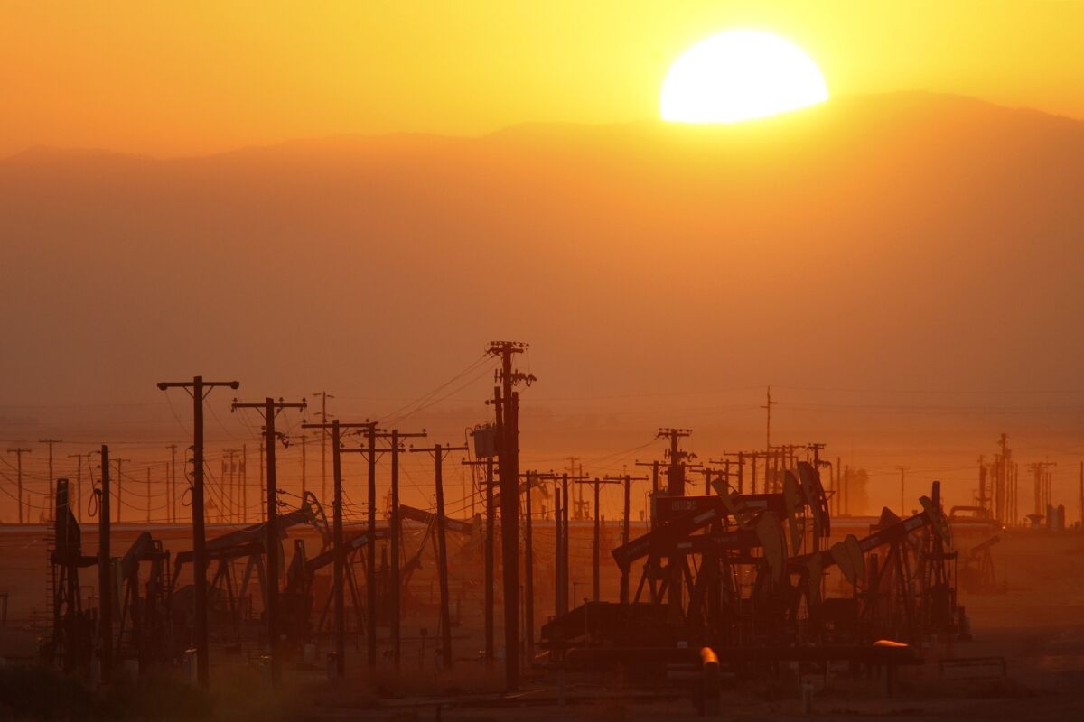 The sun rises over an oil field at the Monterey Shale formation in March 2014 where gas and oil extraction using hydraulic fracturing, or fracking, is on the verge of a boom near Lost Hills, Calif.