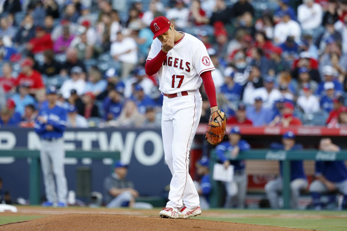 Angels pitcher Shohei Ohtani tries to gather himself during a game against the Toronto Blue Jays.