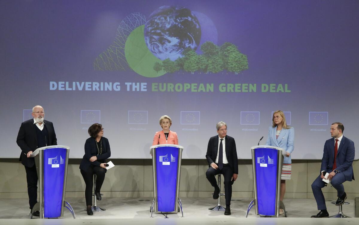European Commission leaders onstage at a news conference