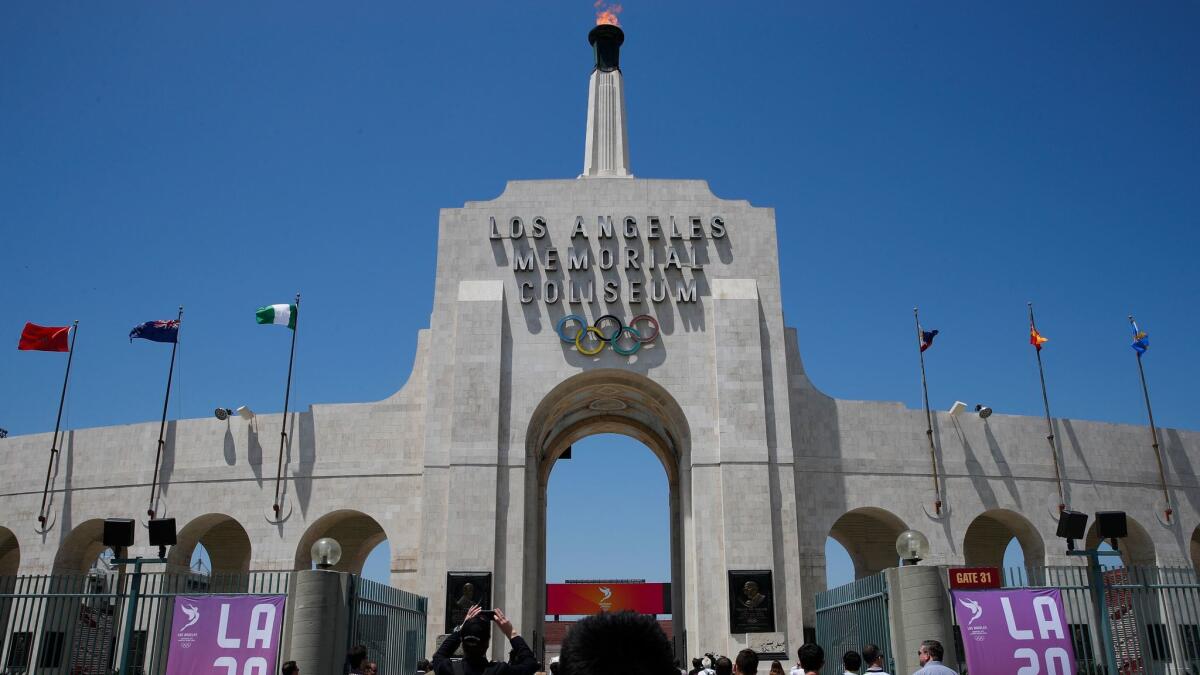 Members of the media enter the Los Angeles Memorial Coliseum on May 11, 2017. L.A. will host the 2028 Olympics.