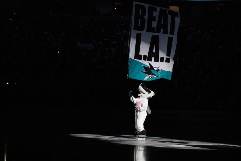 San Jose Sharks mascot Sharkie waves a "Beat L.A." sign while he is dressed up as a bunny for Easter on April 20.