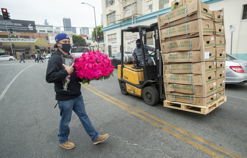 A flower shortage is driving up costs for a Mother's Day of
post-COVID-19 reunions 7 Man with roses