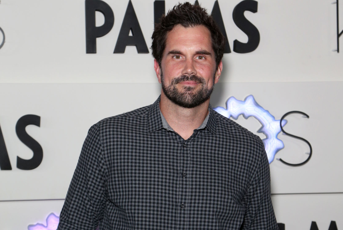 Matt Leinart stands, hands in pockets, in front of a sign at Palms Casino Resort on April 5, 2019, in Las Vegas. 
