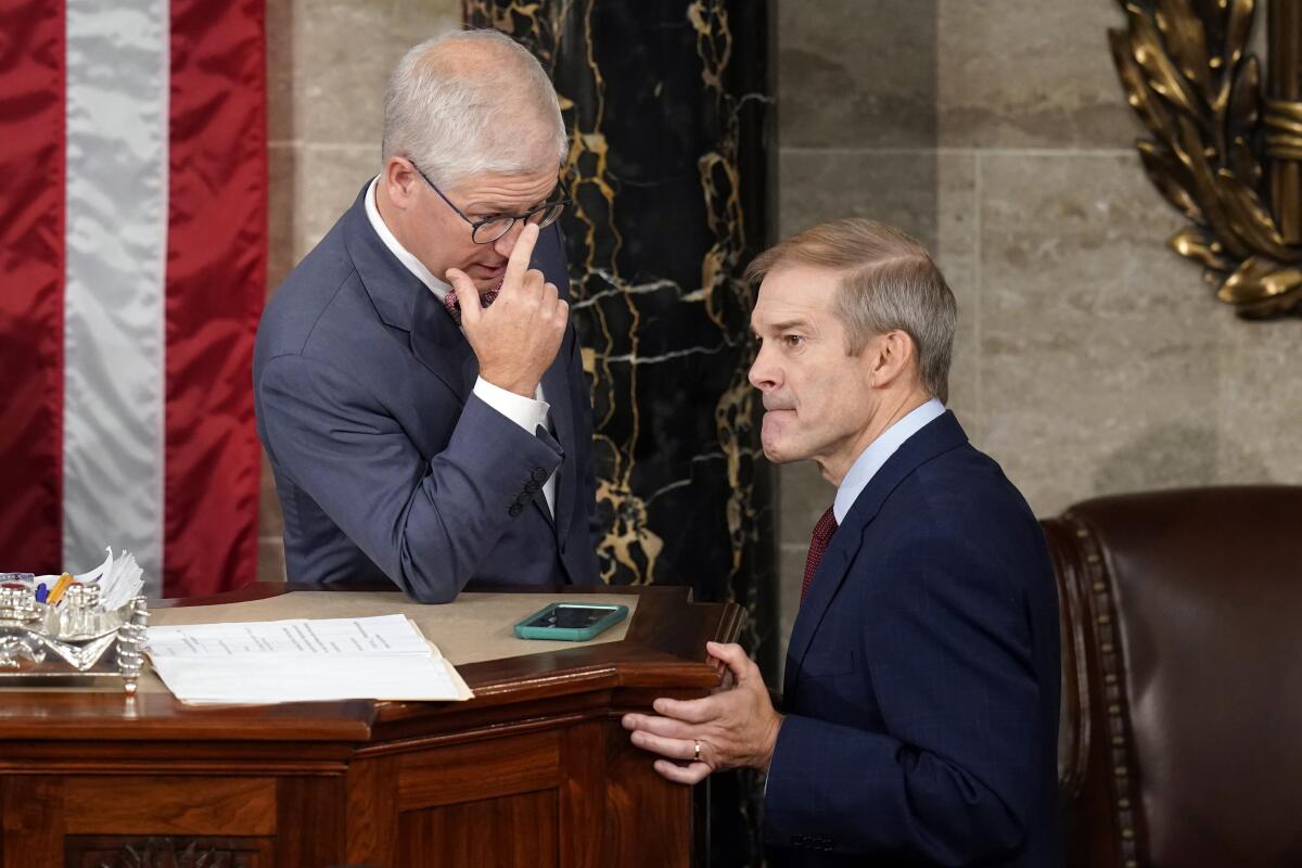 Rep. Patrick McHenry talks with Rep. Jim Jordan on the House floor