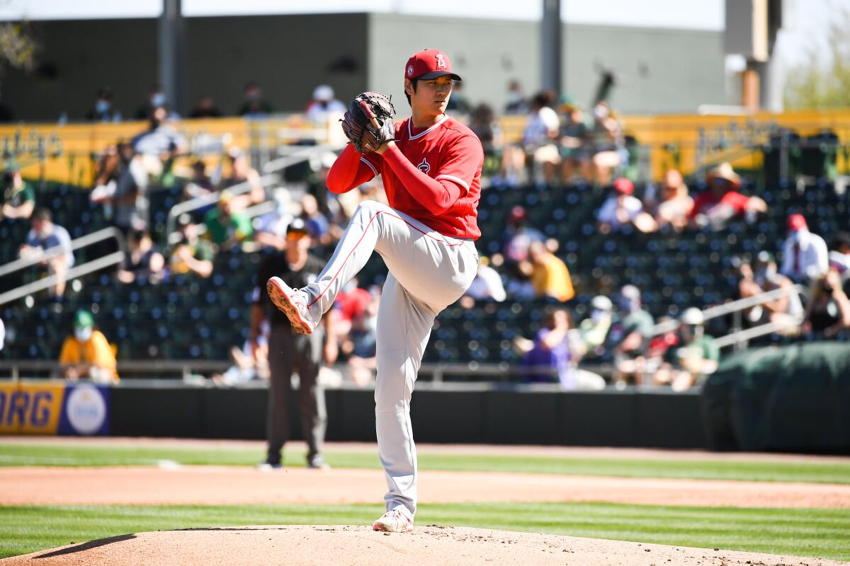 Angels pitcher Shohei Ohtani delivers a pitch during a spring training game against the Oakland Athletics.