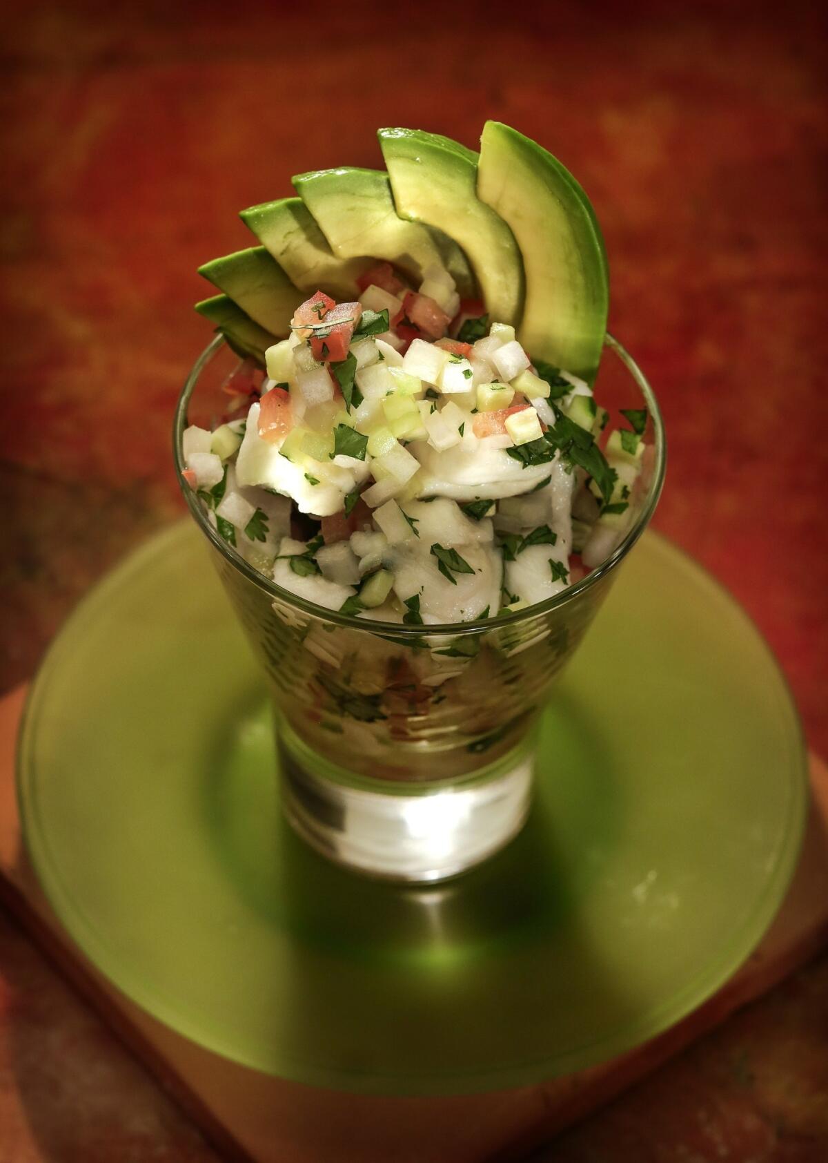 Javier's Ceviche de Pescado is made with fresh Alaskan halibut, lemon, tomato, onions, cilantro, chile,cucumber and avocado. Recipe: Javiers Ceviche de pescado