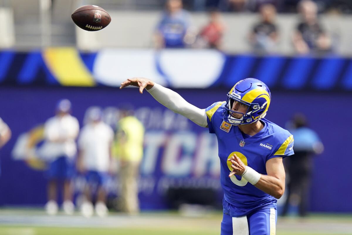 Los Angeles Rams quarterback Matthew Stafford throws during the first half in an NFL football game.
