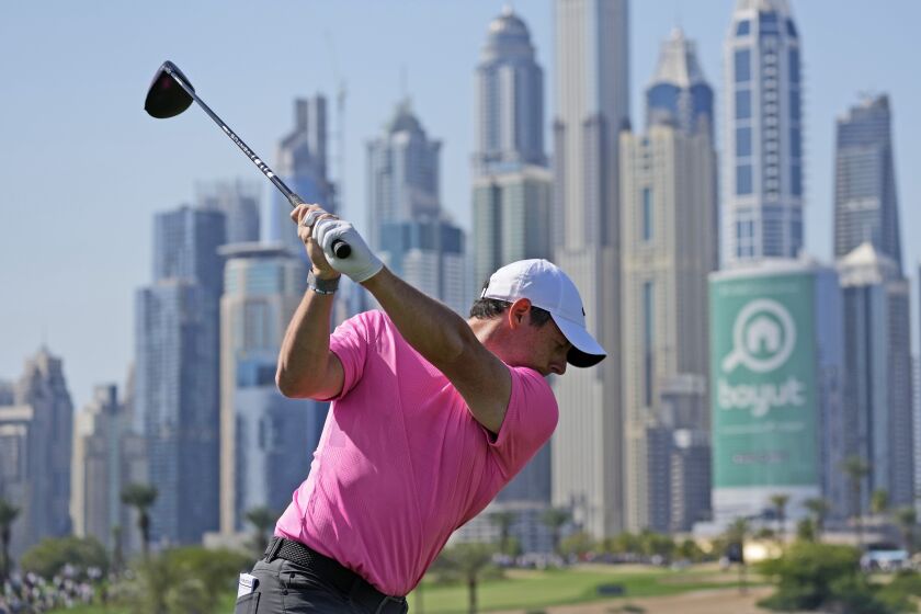 Rory McIlroy of Northern Ireland tees off on the 8th hole during the third round of the Dubai Desert Classic, in Dubai, United Arab Emirates, Sunday, Jan. 29, 2023. (AP Photo/Kamran Jebreili)