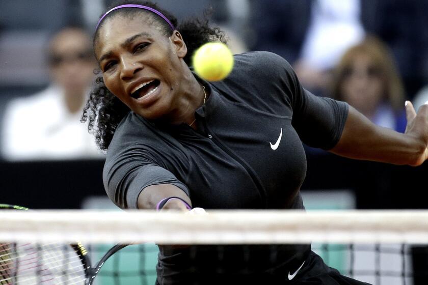 Serena Williams volleys a shot against Irina Begu during their semifinal match at the Italian Open on Saturday