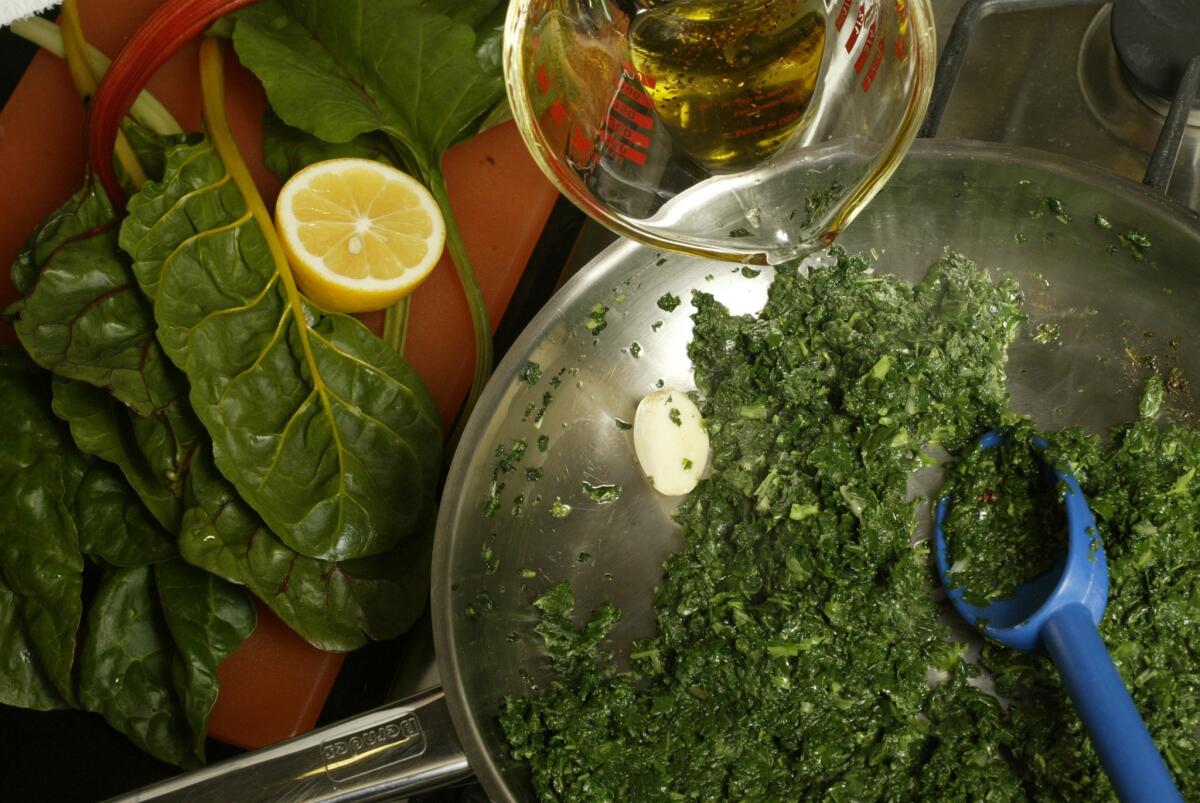 Make an aromatic oil by warming olive oil with cumin seeds, red pepper and lemon zest. Add this a teaspoon or so at a time to braising mixed greens so they absorb the flavor slowly.