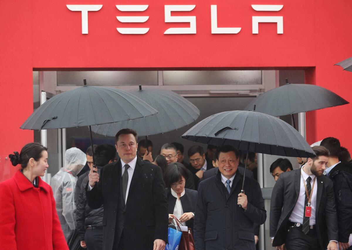 Tesla CEO Elon Musk has tweeted nothing about the current state of Tesla’s new Shanghai factory, nor has he publicly issued other corporate information related to the coronavirus. Above, Musk with Shanghai Mayor Ying Yong last year during the ground-breaking ceremony for Tesla's factory in Shanghai.