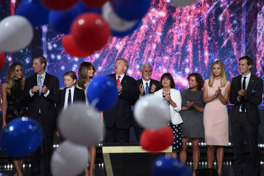 Republican presidential candidate Donald Trump and vice presidential candidate Mike Pence are joined by their families at the end of the Republican National Convention in Cleveland.