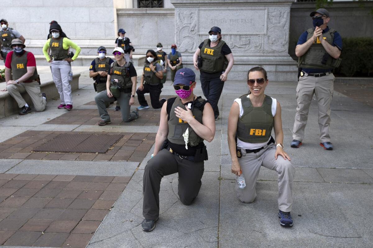 FBI fires agents photographed kneeling during 2020 racial justice ...