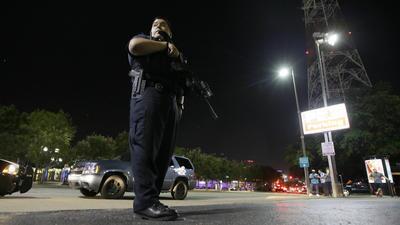 Dallas police stand watch after the shooting.