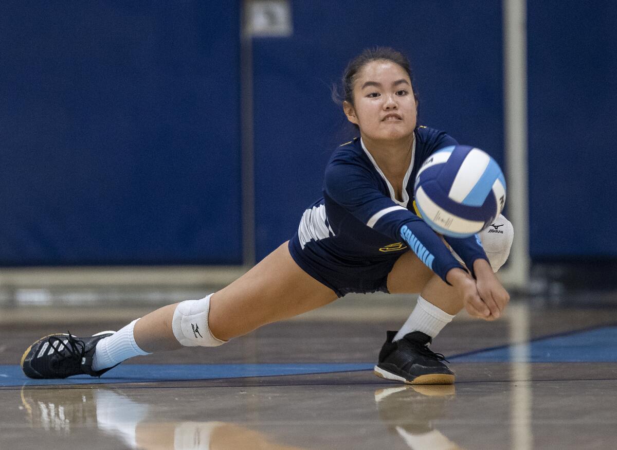 Marina's Dana Tran digs a ball during a nonleague match against Pacifica on Wednesday.