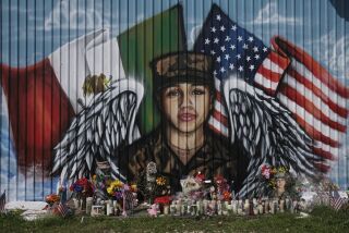 HOUSTON, TX - AUGUST 14: Flowers and candles are left at a mural for murdered U.S. Army Private First Class Vanessa Guillen near Cesar Chavez High School, where a memorial service for Guillen was held, on August 14, 2020 in Houston, Texas. Guillen, a 20-year-old U.S. Army Specialist, was found dead on June 30 after she had been reportedly missing since April 22. Guillen was allegedly killed by fellow soldier Aaron David Robinson inside the Fort Hood military base. (Photo by Go Nakamura/Getty Images)