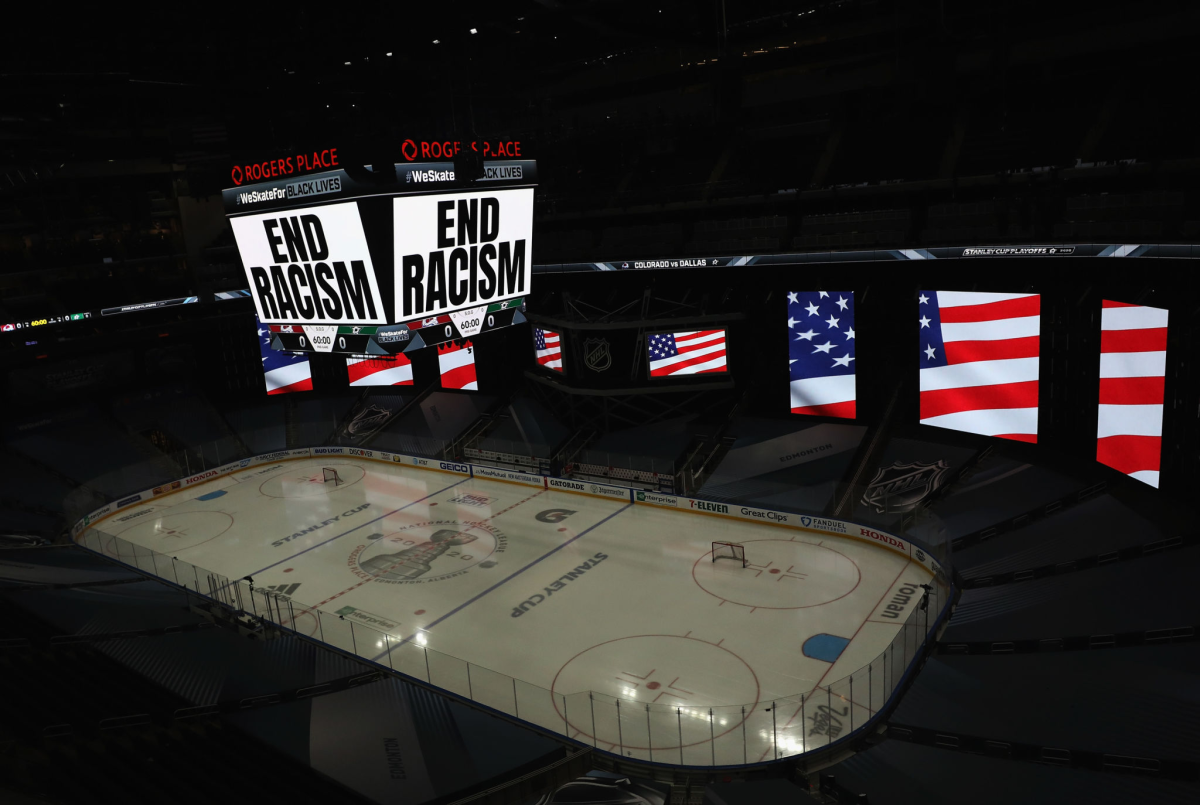 "End Racism" is displayed on the scoreboard in light.