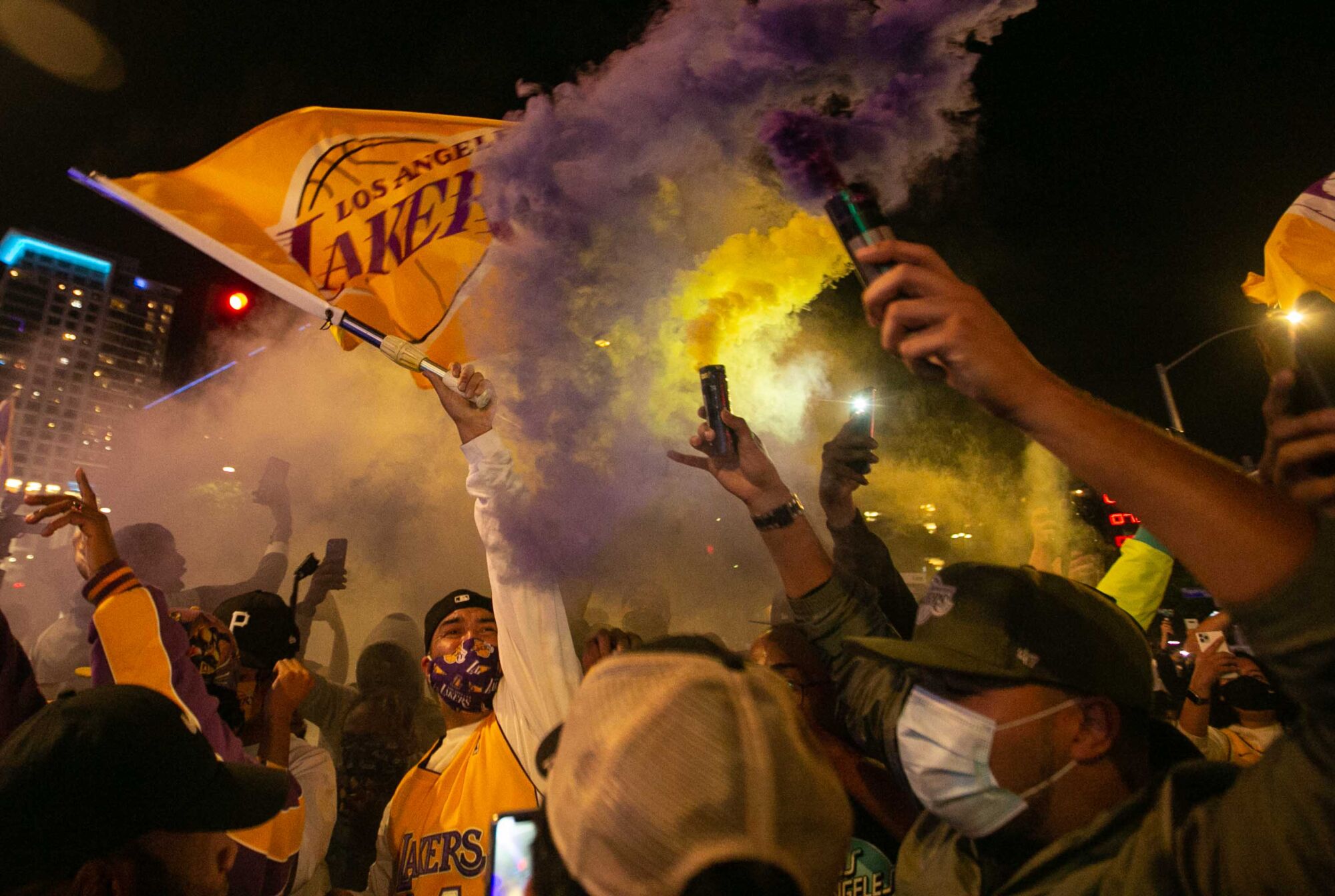 Fans gather near Staples Center to celebrate the Lakers’ NBA Finals win over the Miami Heat on Sunday.
