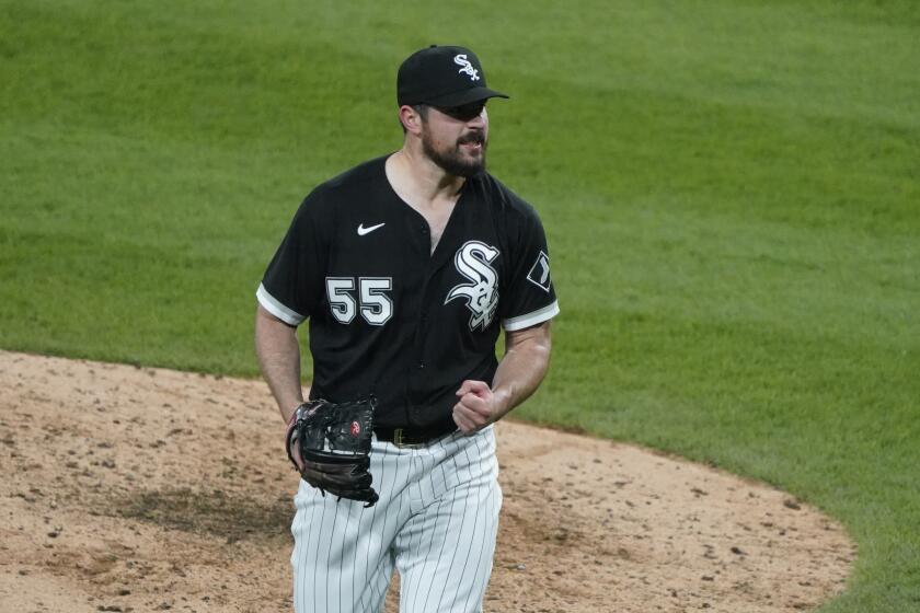 Chicago White Sox starting pitcher Carlos Rodon (55) pumps his fist after striking out Cleveland Indians' Yu Chang (2) to end the sixth inning of a baseball game, Wednesday, April, 14, 2021, in Chicago. (AP Photo/David Banks)