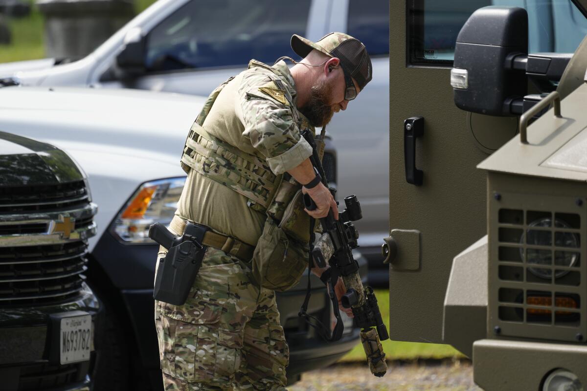 Law enforcement officer checking his firearm