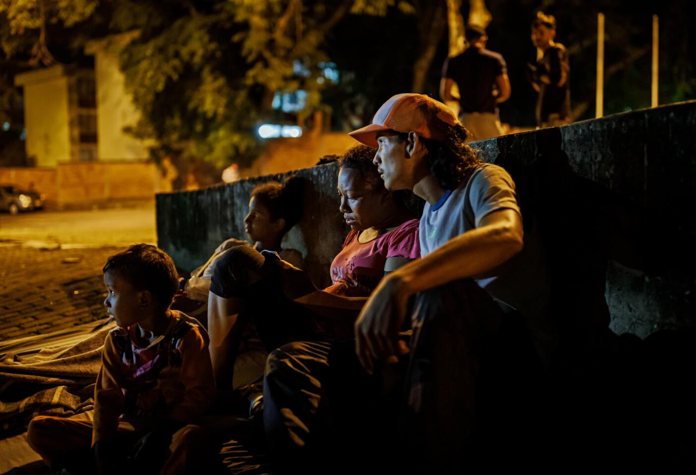 Venezuelans rest at a park in Bucaramanga, Colombia.