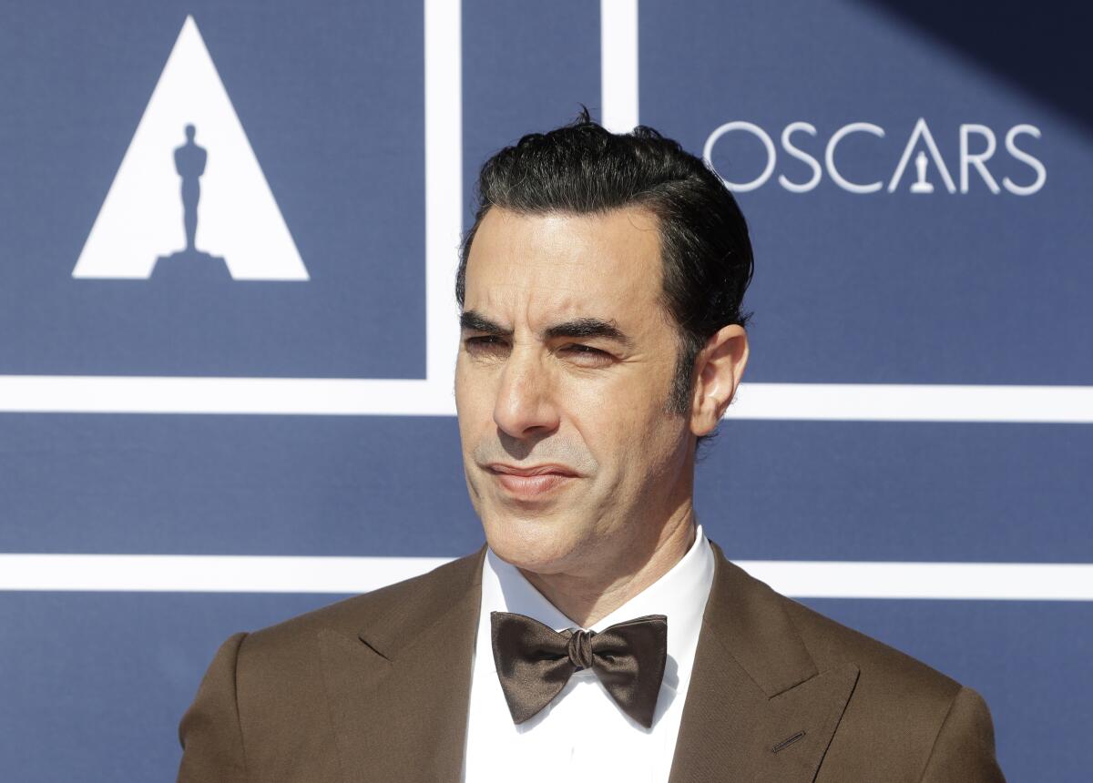 FILE - In this April 26, 2021 file photo, Sacha Baron Cohen arrives to attend a screening of the Oscars in Sydney, Australia. The actor has sued a Massachusetts cannabis dispensary he says used an image of his character Borat on a billboard without his permission. (AP Photo/Rick Rycroft, File)