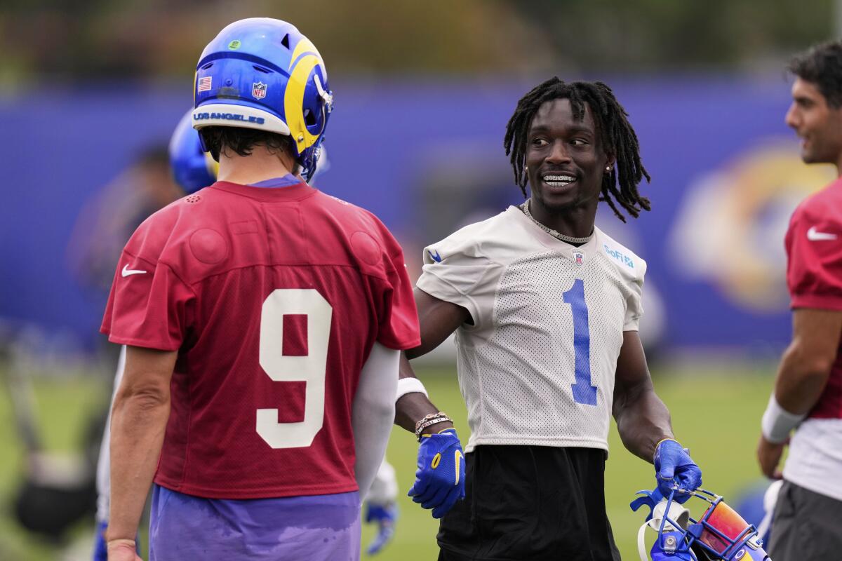 Los Angeles Rams cornerback Derion Kendrick, right, talks with quarterback Matthew Stafford.