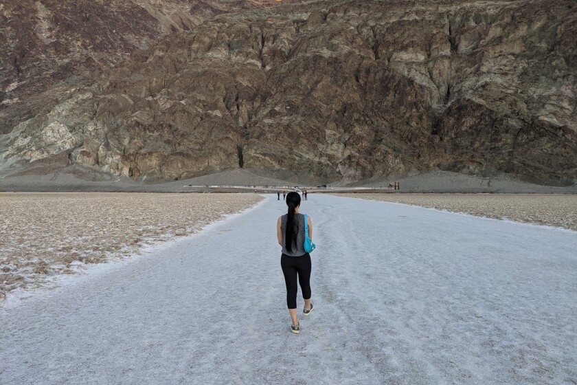 **BADWATER BASIN SALT FLATS Length: 2-mile out and back Elevation gain: Negligible (but you can't get any lower!) Trailhead: 15 miles south of Furnace Creek, off of Badwater Rd Parking: Paved lot (National Park entrance fee required) Want to go down in history? Everybody can at Badwater Basin Salt Flats in Death Valley National Park - here's the lowdown. Sitting at 282 feet below sea level, the mostly sodium chloride-covered flats cover nearly 200 square miles and earned their name when a mule refused to drink from the pool next to the interpretive boardwalk. The high salinity environment actually houses an endemic snail (found only here!) and pickleweed, and is the product of the evaporation of an ancient lake. Walk out over the hexagonal crusts towards the prominent apex of Telescope Peak (11,049 feet), which is particularly gorgeous when draped in a blue blanket at sunset. Also, check out the Sea Level sign marker on the cliffs to the east for another reminder that you are currently at the lowest point in North America. It's all uphill from here - in fact, check out Dante's View, a breathtaking lookout that offers a different perspective on the basin.