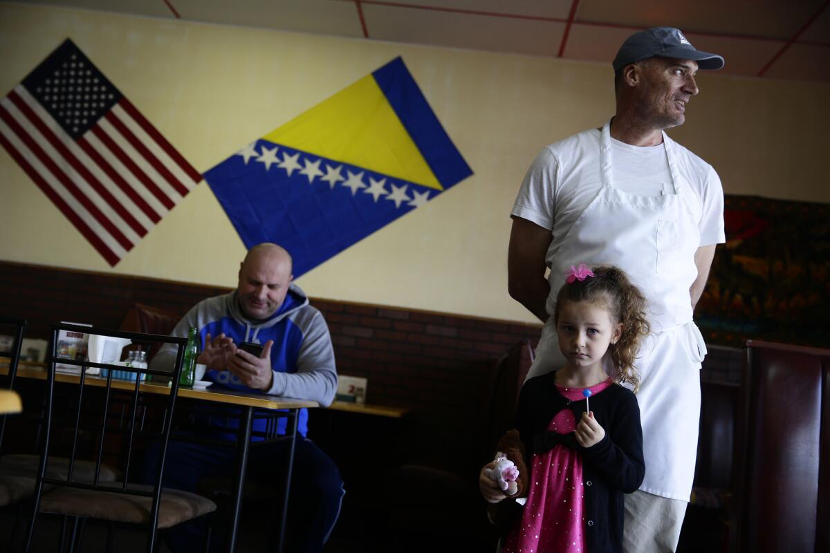 Emma's Cafe owner Eshef Jasarevic, right, with his daughter, Emma at their restaurant. Jasarevic, a Bosnian refugee, escaped his war-torn country in 1999 and settled in Twin Falls, Idaho.