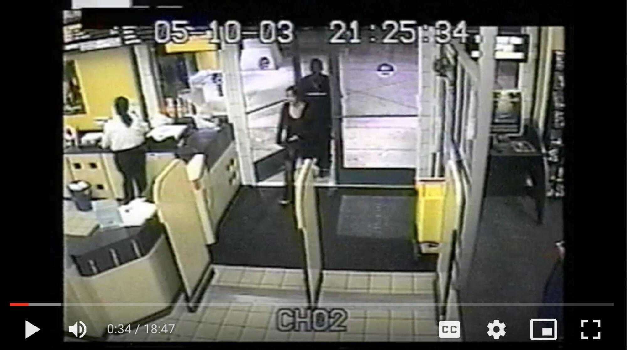 A frame of a surveillance video shows the inside of a store.